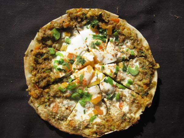 Chatamari, the Newari rice-flour crepe topped with minced meat and egg