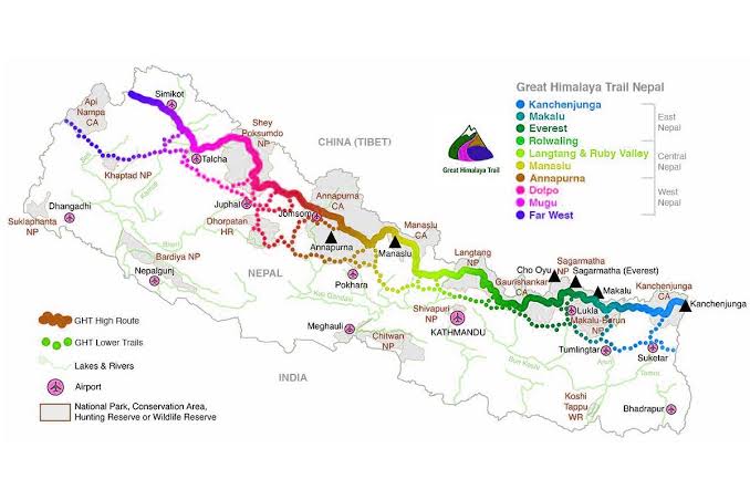 A trekker on the Great Himalayan Trail with stunning mountain views