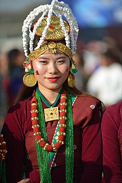Gurung men in traditional dress performing a cultural dance