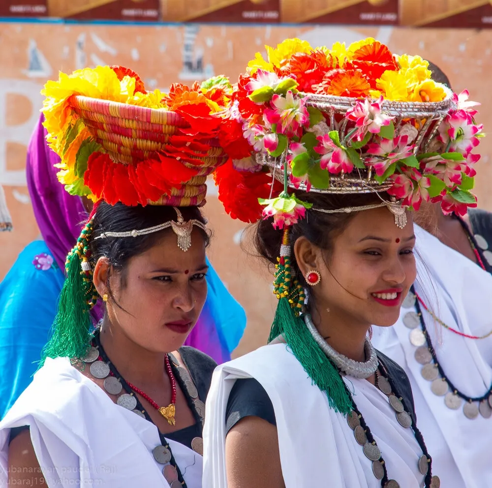 Tharu women in traditional dress performing the stick dance in Chitwan