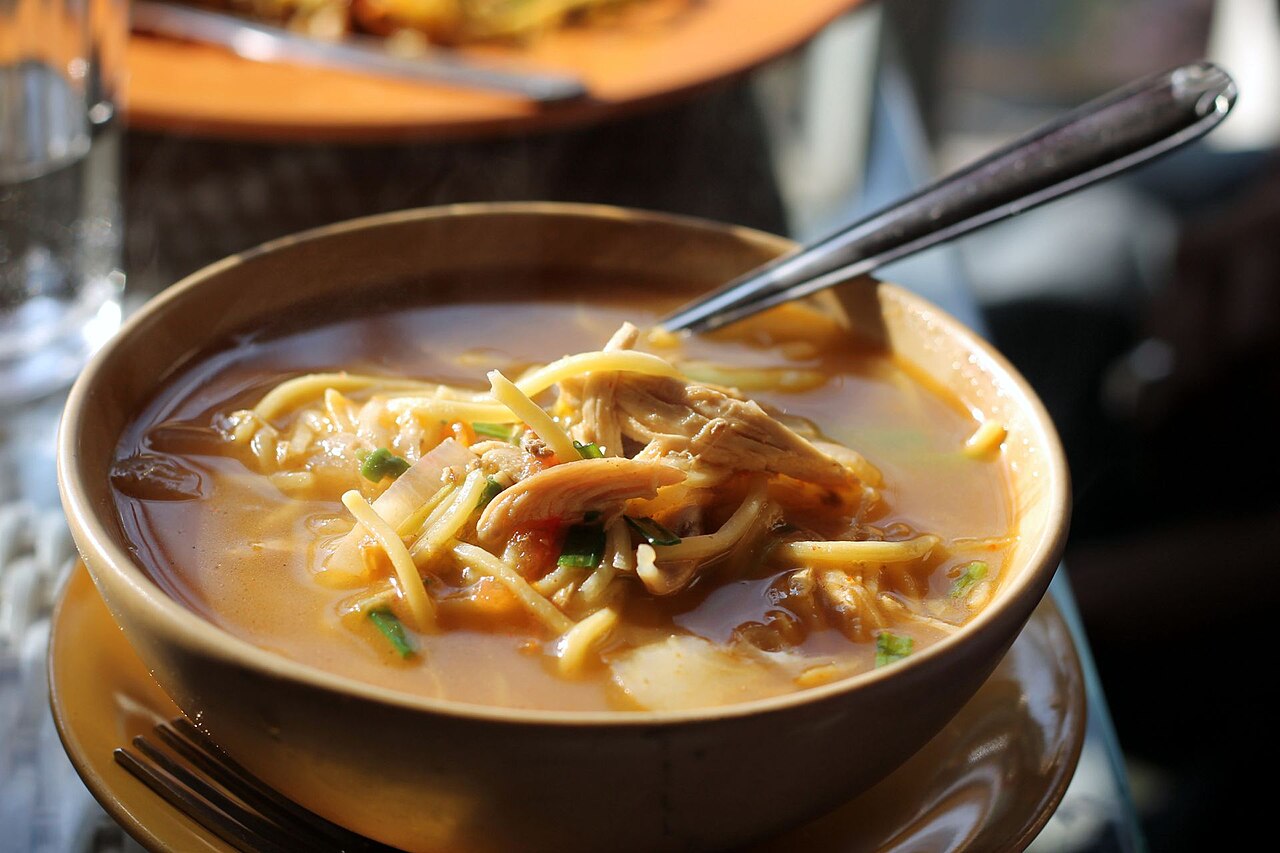A steaming bowl of Thukpa noodle soup, a Himalayan specialty