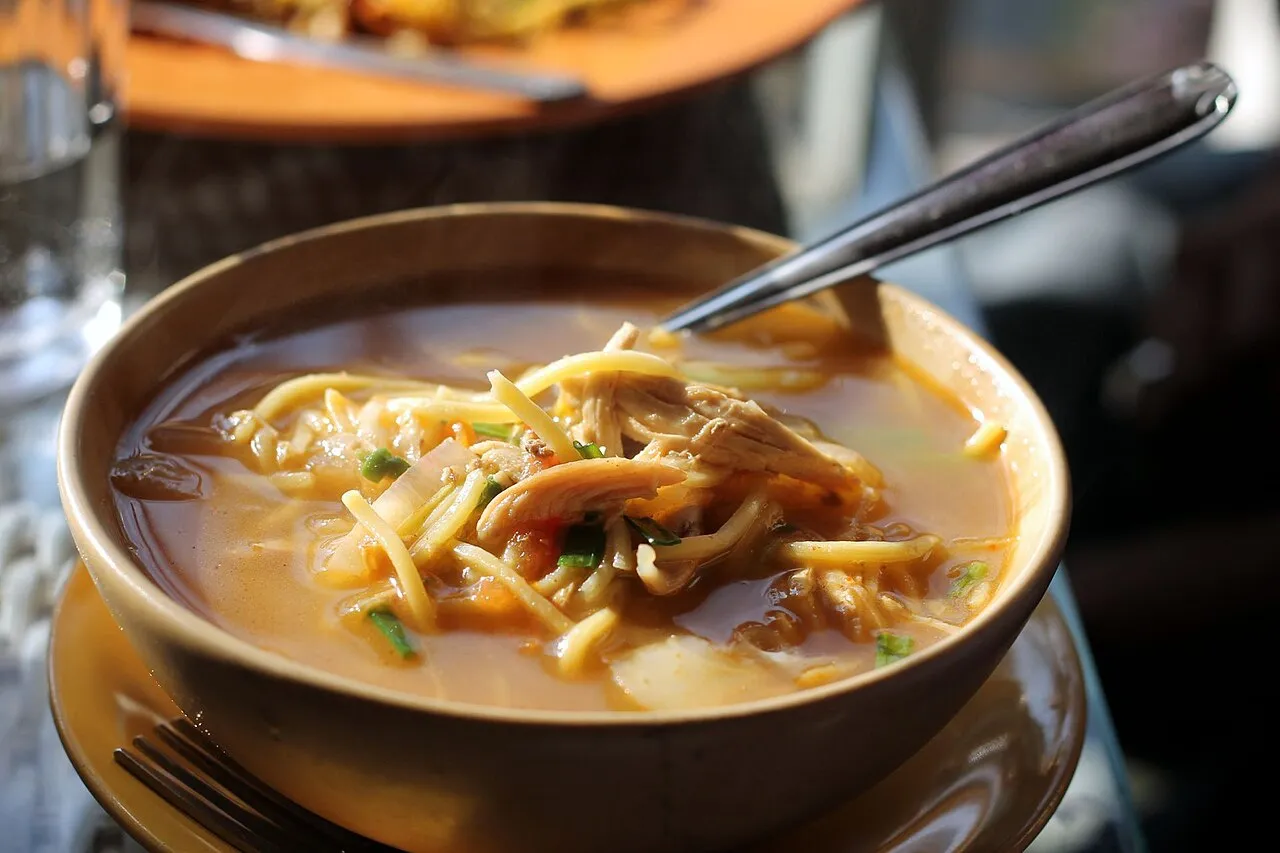 A steaming bowl of Thukpa noodle soup, a Himalayan specialty